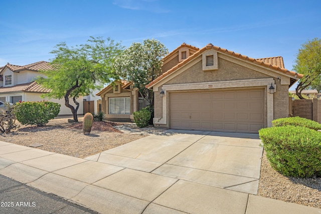 4131 E Cascalote Dr, Cave Creek, AZ 85331 - view of front of home featuring concrete driveway, stucco siding, an attached garage, and a tiled roof