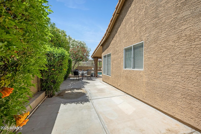 4131 E Cascalote Dr, Cave Creek, AZ 85331 - view of property exterior featuring a patio, a fenced backyard, and stucco siding