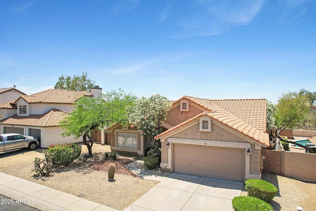 4131 E Cascalote Dr, Cave Creek, AZ 85331 - view of front of property with concrete driveway, a garage, a tiled roof, and stucco siding