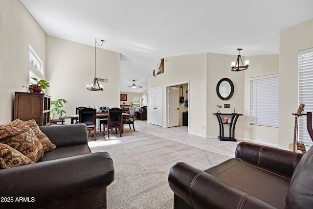 4131 E Cascalote Dr, Cave Creek, AZ 85331 - living room with a chandelier, light tile patterned flooring, and high vaulted ceiling
