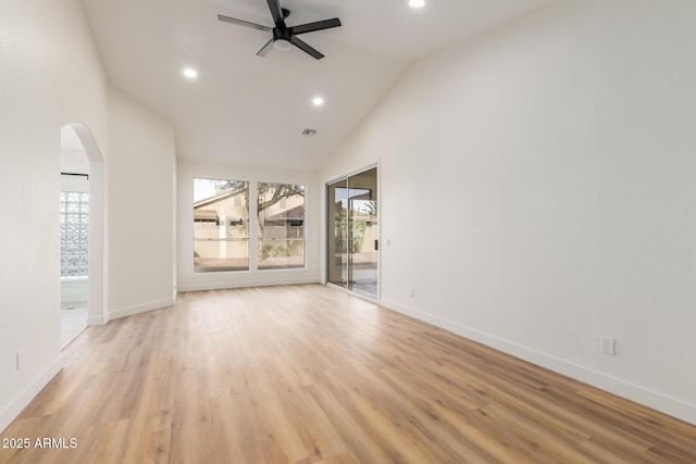 unfurnished room with light wood-type flooring, vaulted ceiling, and ceiling fan