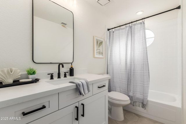 full bathroom featuring toilet, tile patterned floors, vanity, and shower / tub combo with curtain