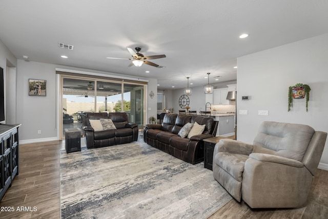 living room featuring ceiling fan