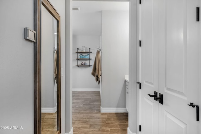 bathroom featuring vanity and hardwood / wood-style flooring