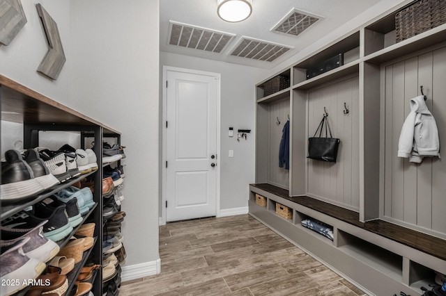 mudroom with hardwood / wood-style floors