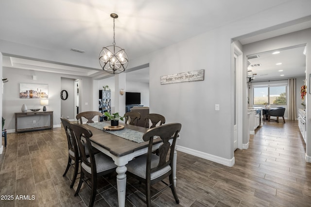 dining space featuring an inviting chandelier