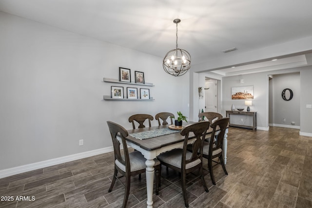 dining room with a notable chandelier