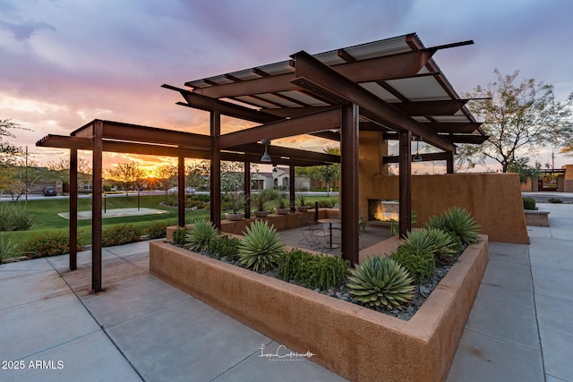 view of patio terrace at dusk