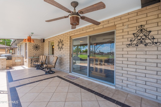 view of patio / terrace with area for grilling and ceiling fan