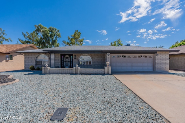 single story home featuring a garage