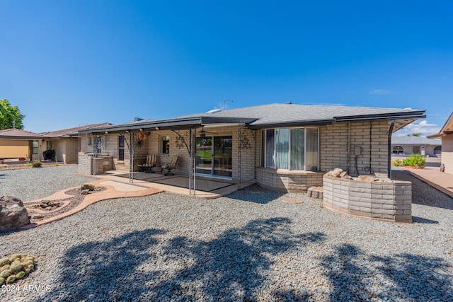 rear view of house featuring a patio area