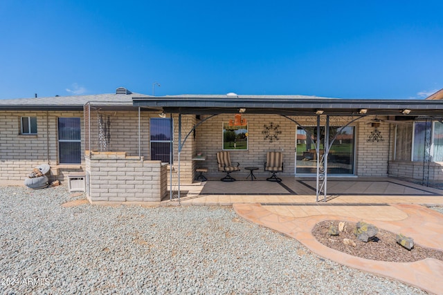 rear view of house featuring a patio