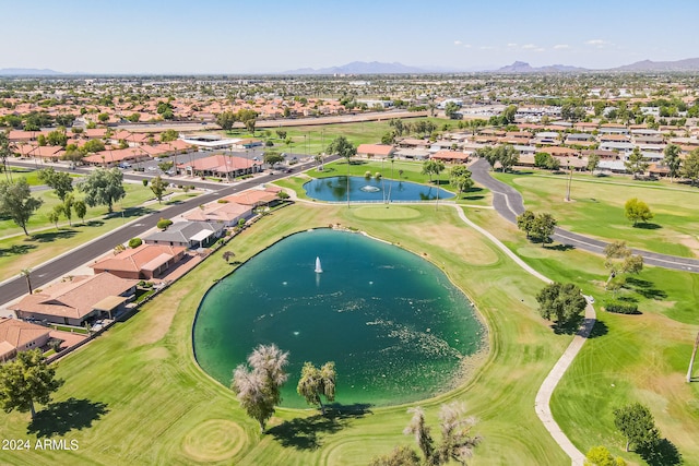 birds eye view of property with a water and mountain view