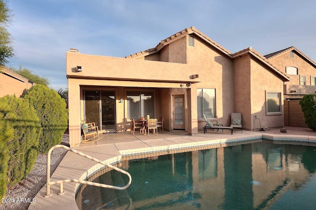 rear view of house with a patio