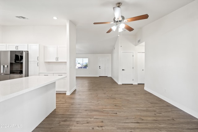 kitchen with white cabinets, ceiling fan, wood-type flooring, and stainless steel refrigerator with ice dispenser