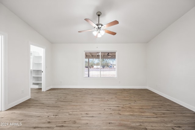 empty room featuring hardwood / wood-style flooring and ceiling fan