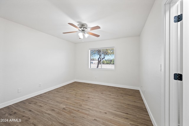 spare room with wood-type flooring and ceiling fan