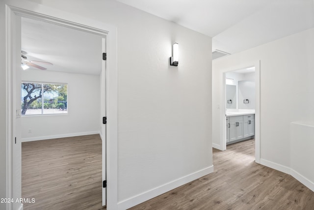 hall with light hardwood / wood-style flooring