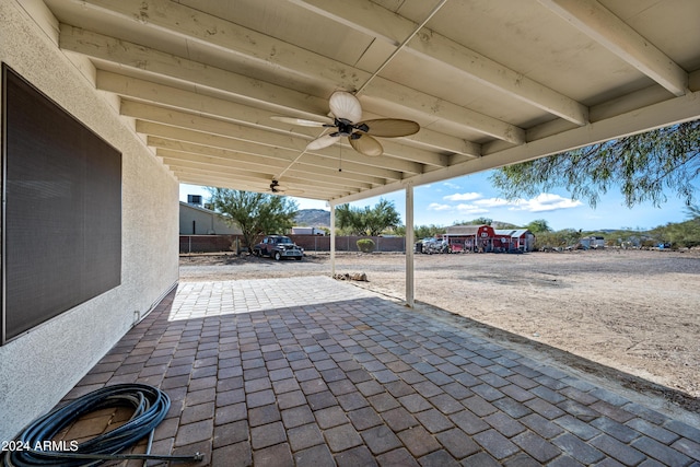 view of patio / terrace featuring ceiling fan