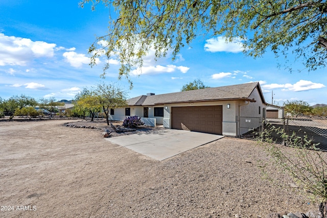 single story home featuring a garage