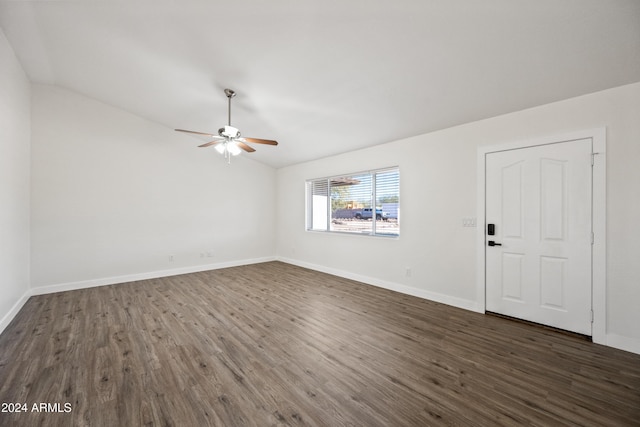 empty room with dark hardwood / wood-style floors, ceiling fan, and lofted ceiling