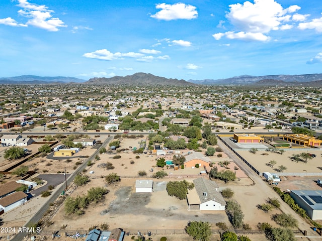 birds eye view of property with a mountain view