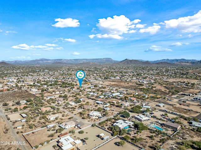 birds eye view of property with a mountain view