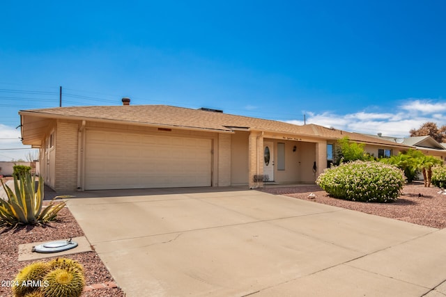 ranch-style home featuring a garage