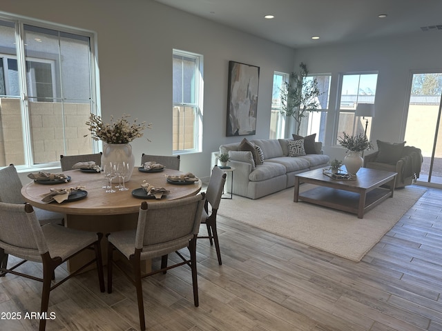 dining space featuring light wood-type flooring