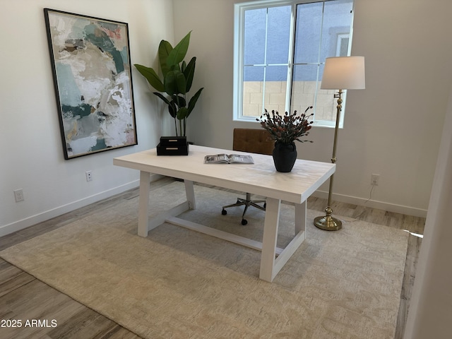 office area with light hardwood / wood-style floors