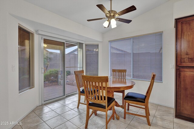 kitchen featuring light tile patterned floors, appliances with stainless steel finishes, sink, high vaulted ceiling, and decorative backsplash