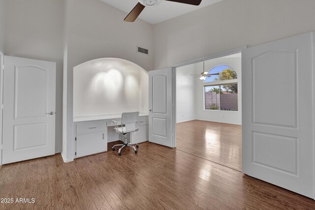 unfurnished room featuring ceiling fan and hardwood / wood-style floors