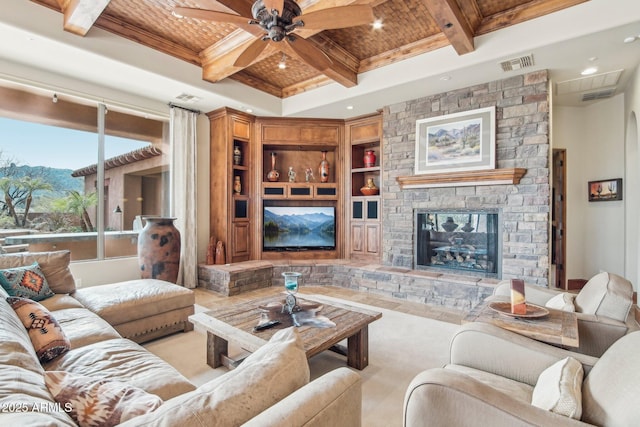 living room featuring beam ceiling, visible vents, coffered ceiling, and built in features