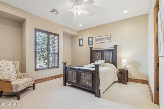 bedroom featuring a ceiling fan, light colored carpet, visible vents, and baseboards