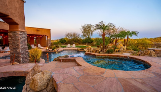 pool featuring a patio area and fence