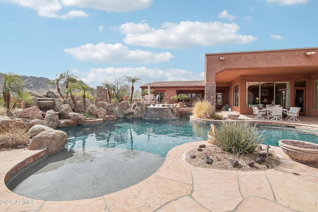 outdoor pool featuring a patio area