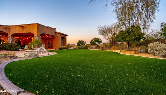 view of yard featuring a patio and fence