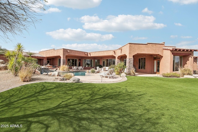 back of house featuring an outdoor pool, a patio area, a yard, and stucco siding