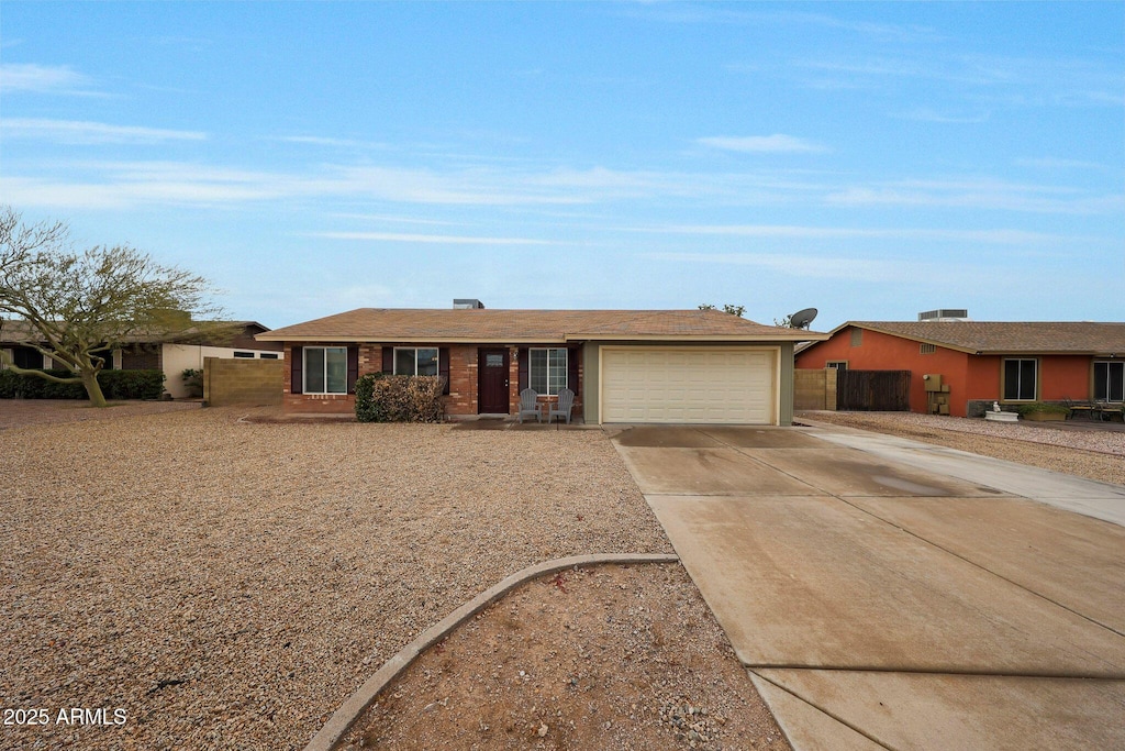 single story home with a garage