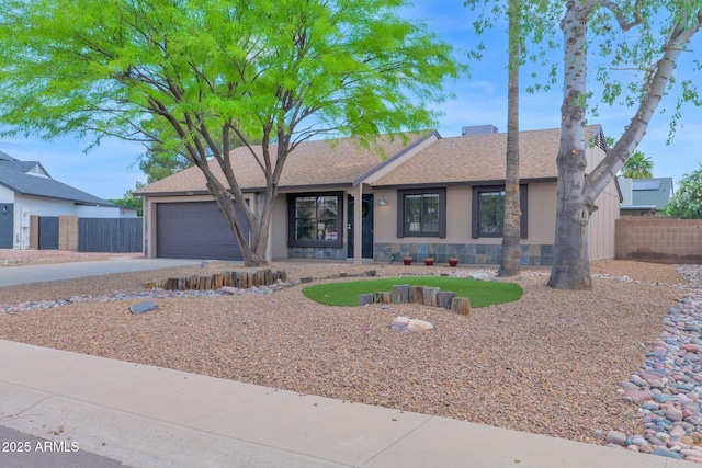 16421 N 65th Pl, Scottsdale, AZ 85254 - ranch-style home with fence, concrete driveway, a garage, and a shingled roof