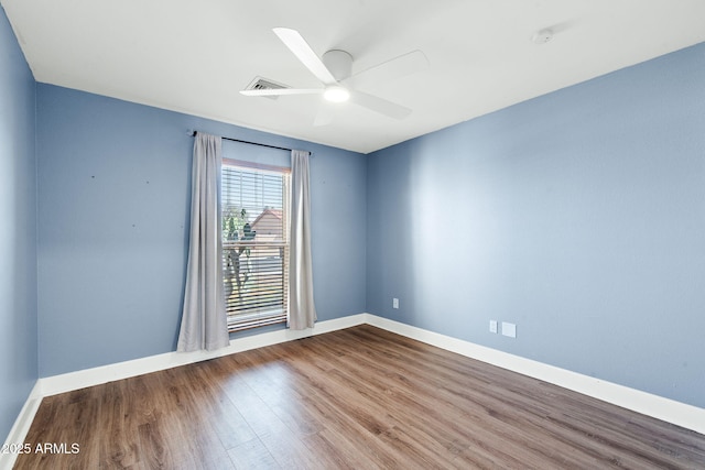 5841 W Kesler St, Chandler, AZ 85226 - unfurnished room featuring wood finished floors, ceiling fan, and baseboards