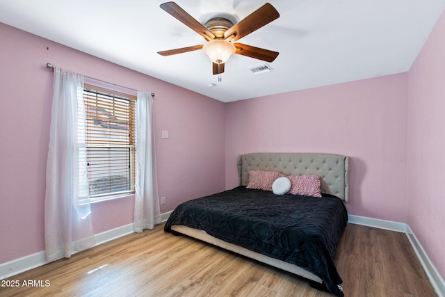 5841 W Kesler St, Chandler, AZ 85226 - bedroom with wood finished floors, baseboards, and a ceiling fan