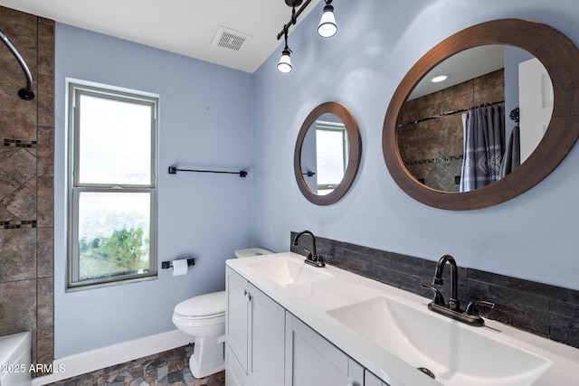 5841 W Kesler St, Chandler, AZ 85226 - bathroom with healthy amount of natural light, double vanity, toilet, and baseboards