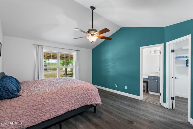5841 W Kesler St, Chandler, AZ 85226 - bedroom featuring vaulted ceiling, dark wood-style flooring, baseboards, a ceiling fan, and connected bathroom