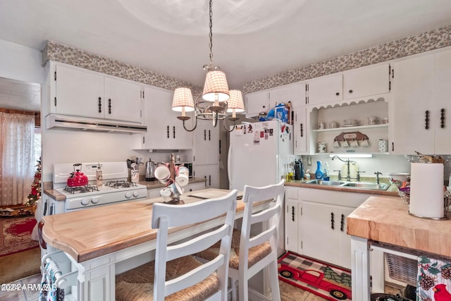 dining room with a chandelier and sink