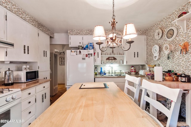 kitchen with white cabinetry, pendant lighting, white appliances, and sink