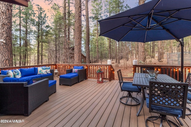 wooden deck with an outdoor living space