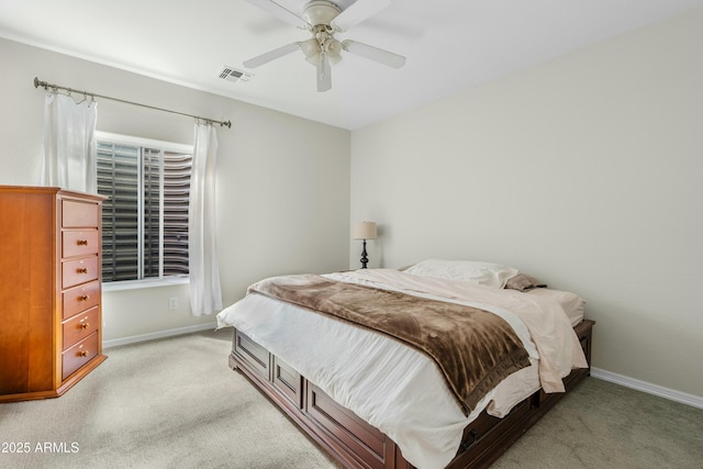 bedroom with baseboards, visible vents, ceiling fan, and light colored carpet