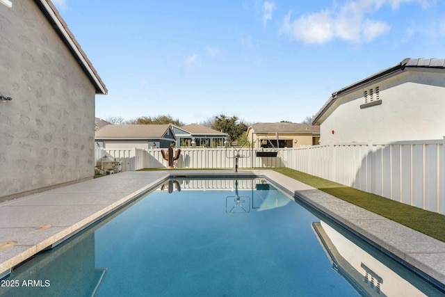 view of swimming pool featuring a fenced backyard and a fenced in pool