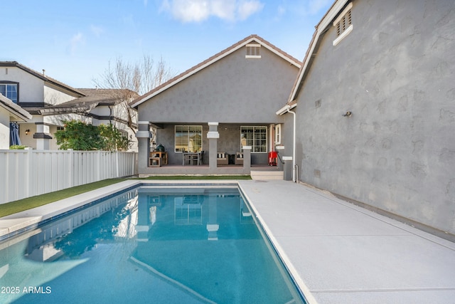 view of pool with a patio area, fence, and a fenced in pool